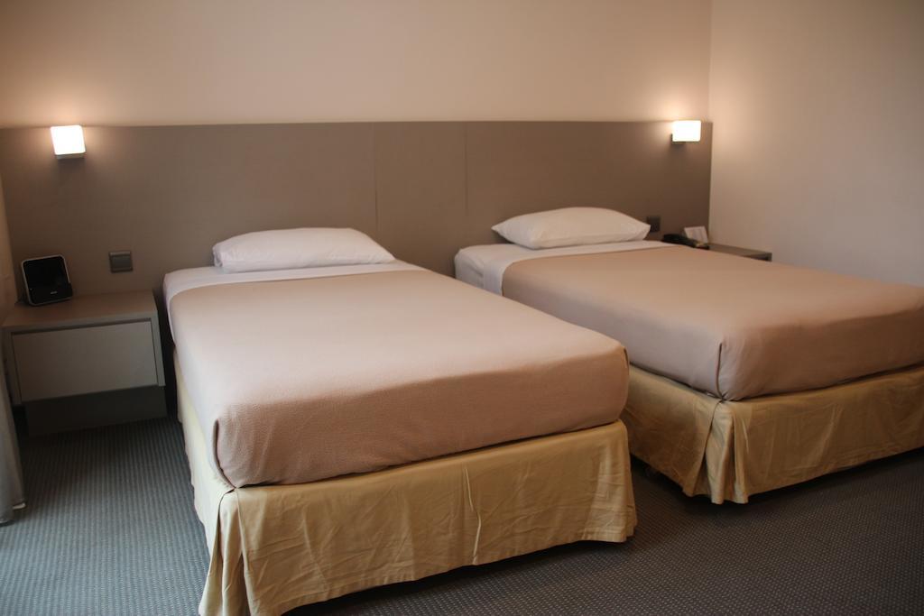 Classique Hotel Сингапур Номер фото